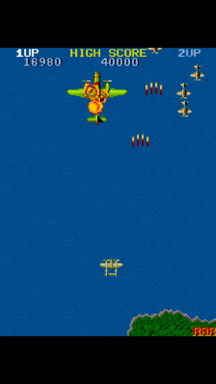 A screenshot from the game 1942, with the player P-38 fighter engaged in aerial combat with a variety of enemy Japanese aircraft.
